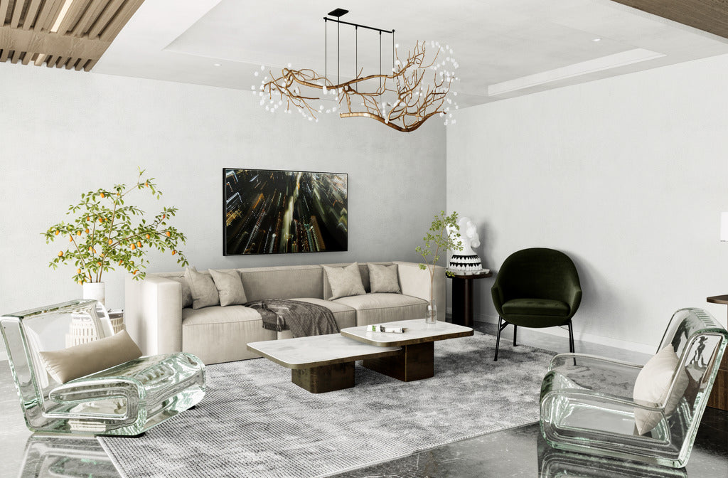 Modern living room with a gray sectional sofa, glass chairs, and a chandelier.