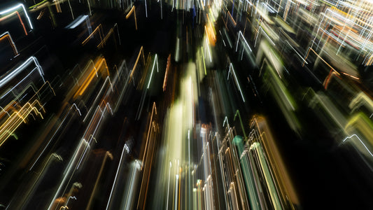 Aerial view of lights breaking across a decending city