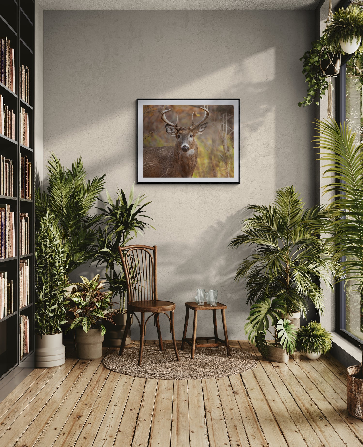 fine art deer print on the wall in rustic library room with plants.